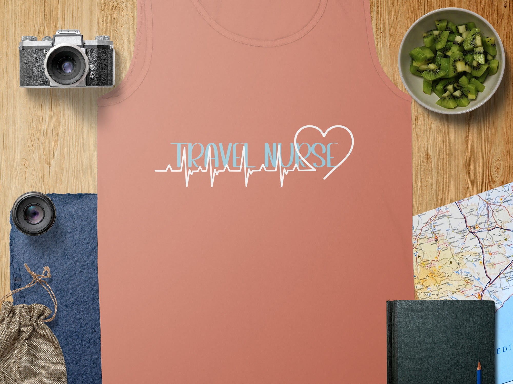 Coral tank top with "Travel Nurse" and a heart-shaped EKG line.