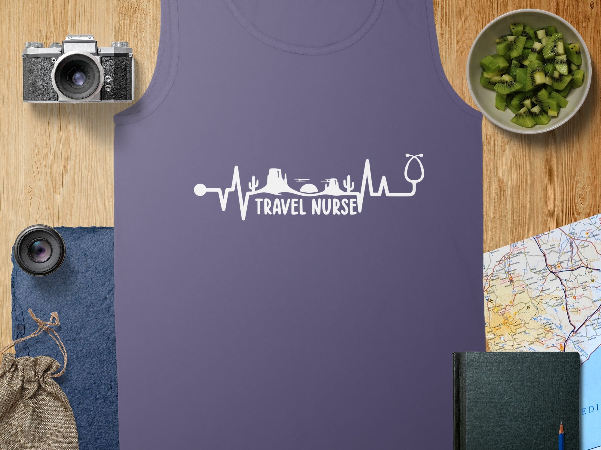 Purple tank top with a white "Travel Nurse" heartbeat and stethoscope graphic.