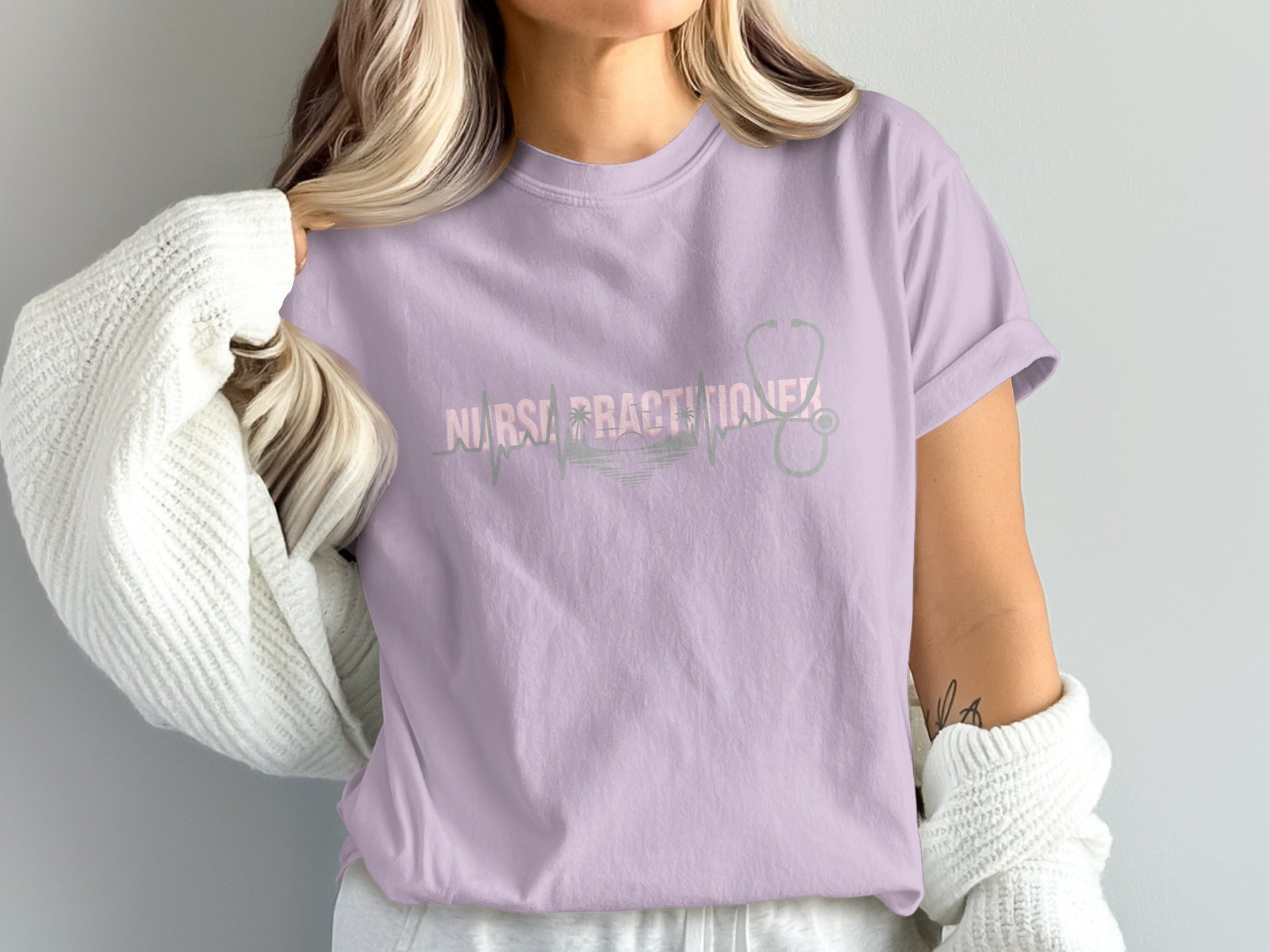 Purple t-shirt with "Nurse Practitioner" text and stethoscope graphic.