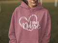Pink hoodie with "TRAVEL NURSE" text inside a heart outline.