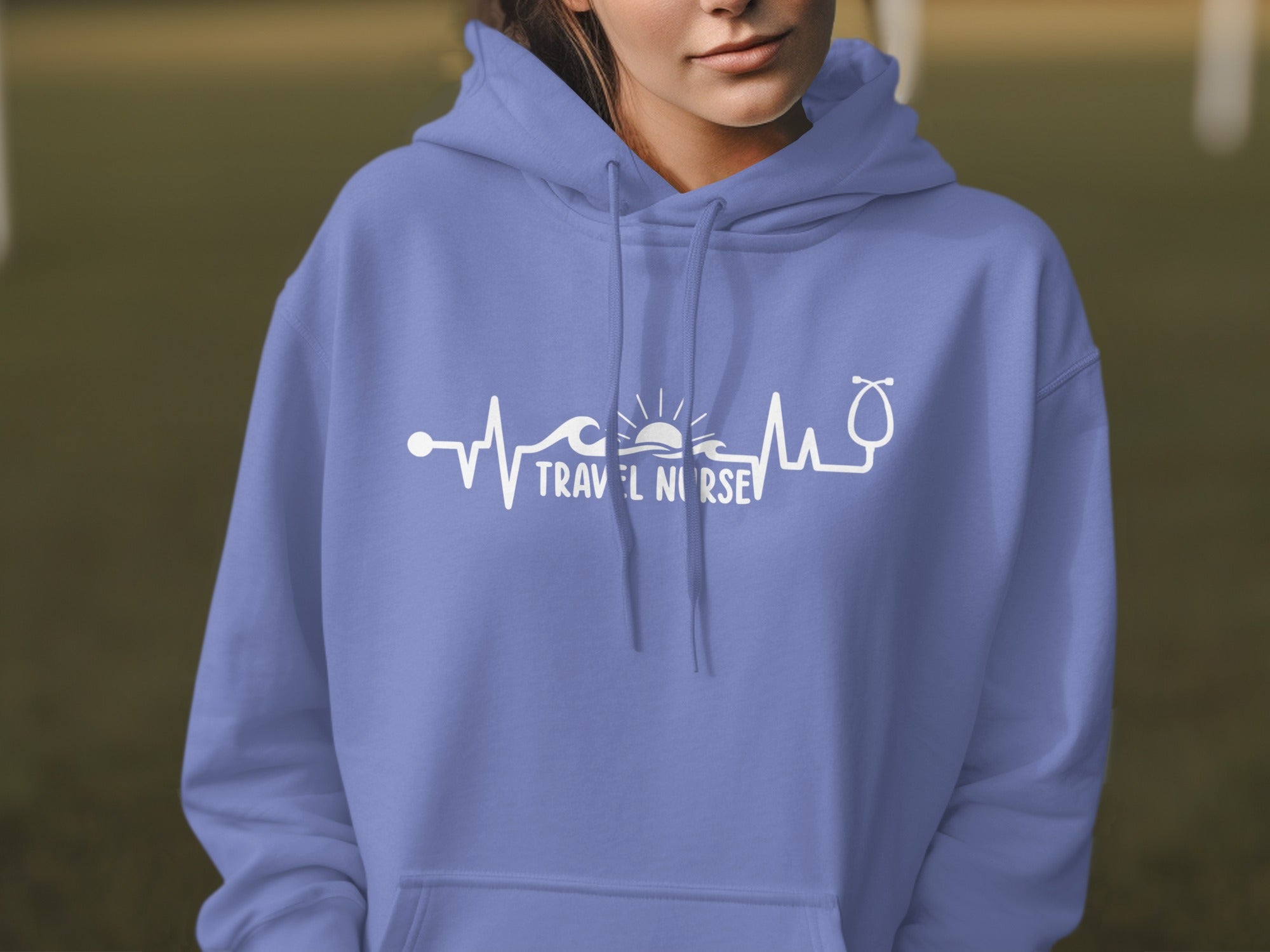 Purple hoodie with "Travel Nurse" text and a heart rate line graphic.