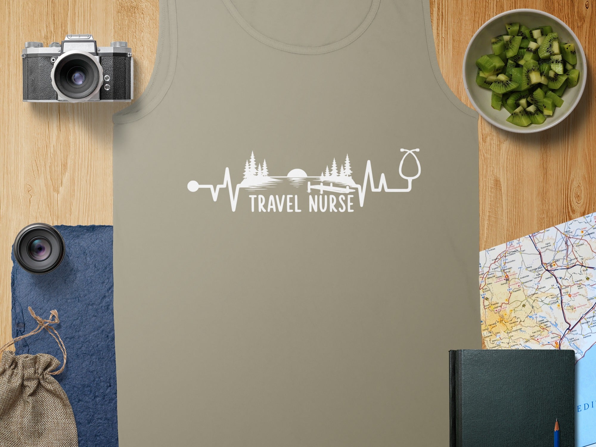 Tan tank top with "Travel Nurse" graphic over a heartbeat and stethoscope design.