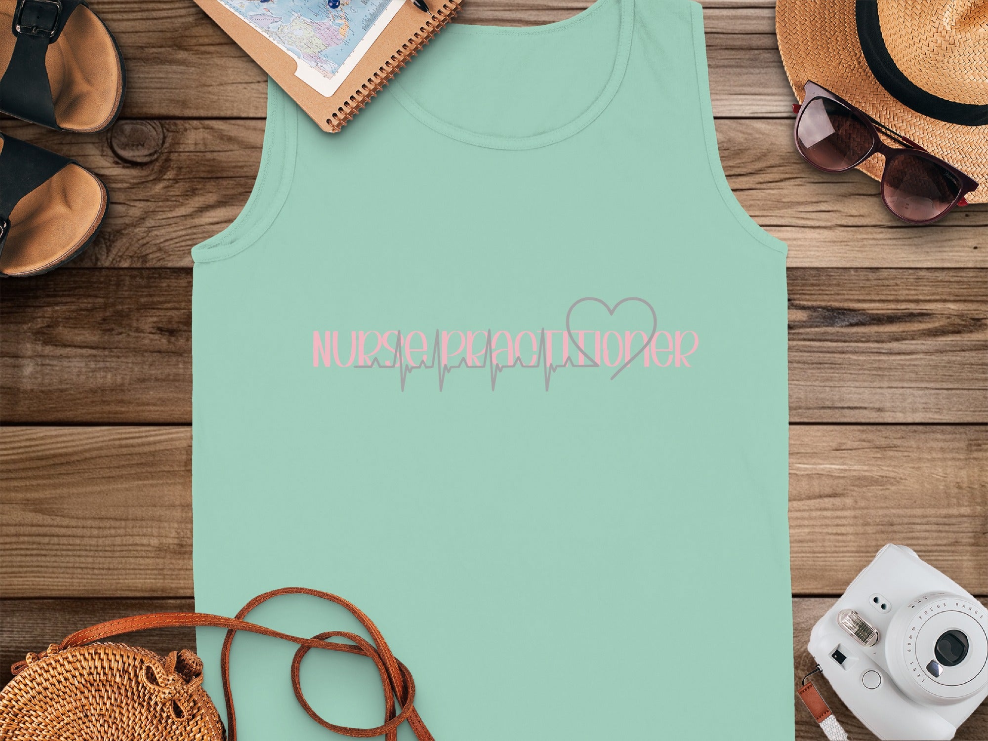 Mint green tank top with "Nurse Practitioner" and heartbeat line graphic.