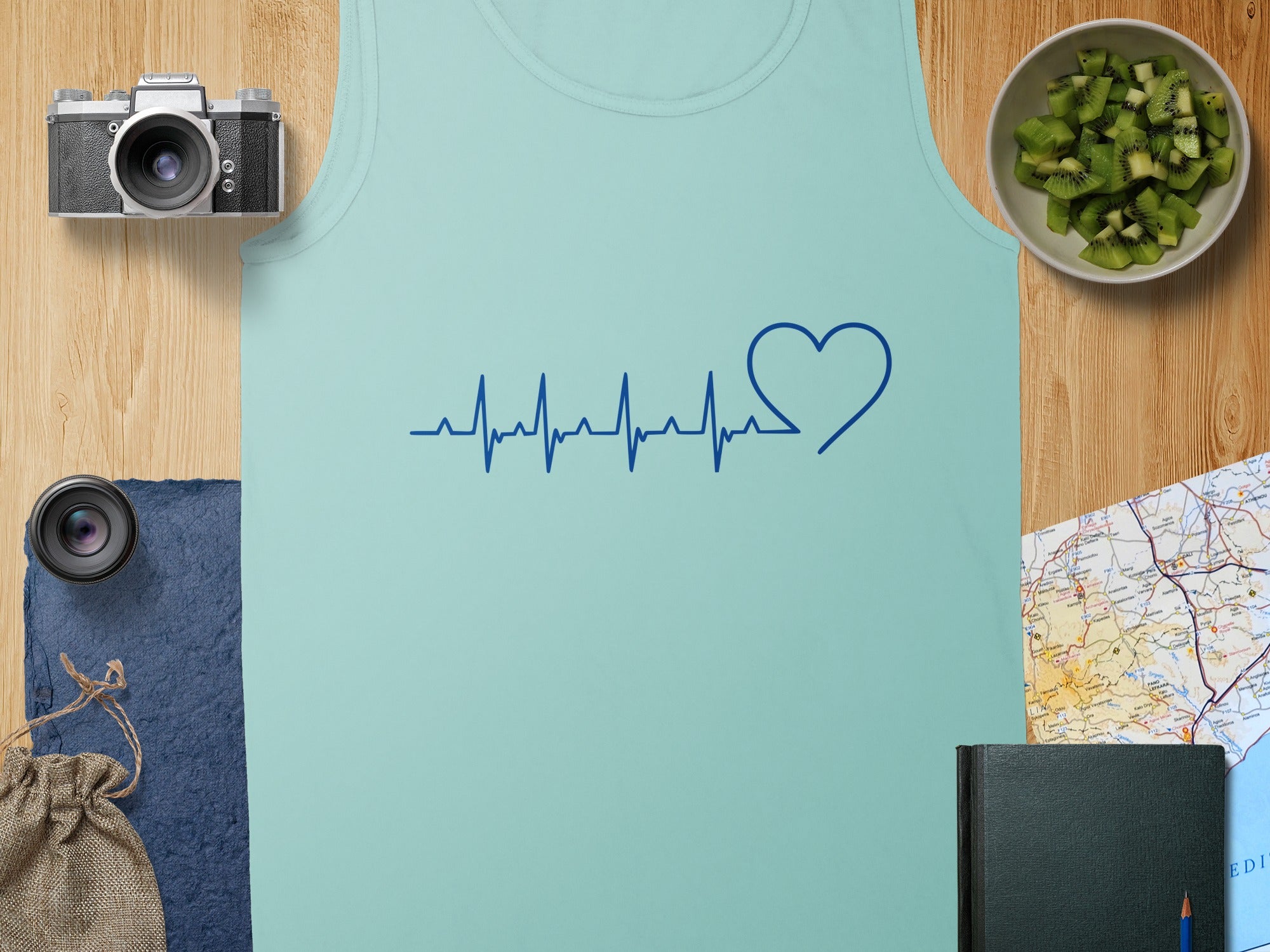 Light blue tank top with a blue heartbeat and heart graphic.
