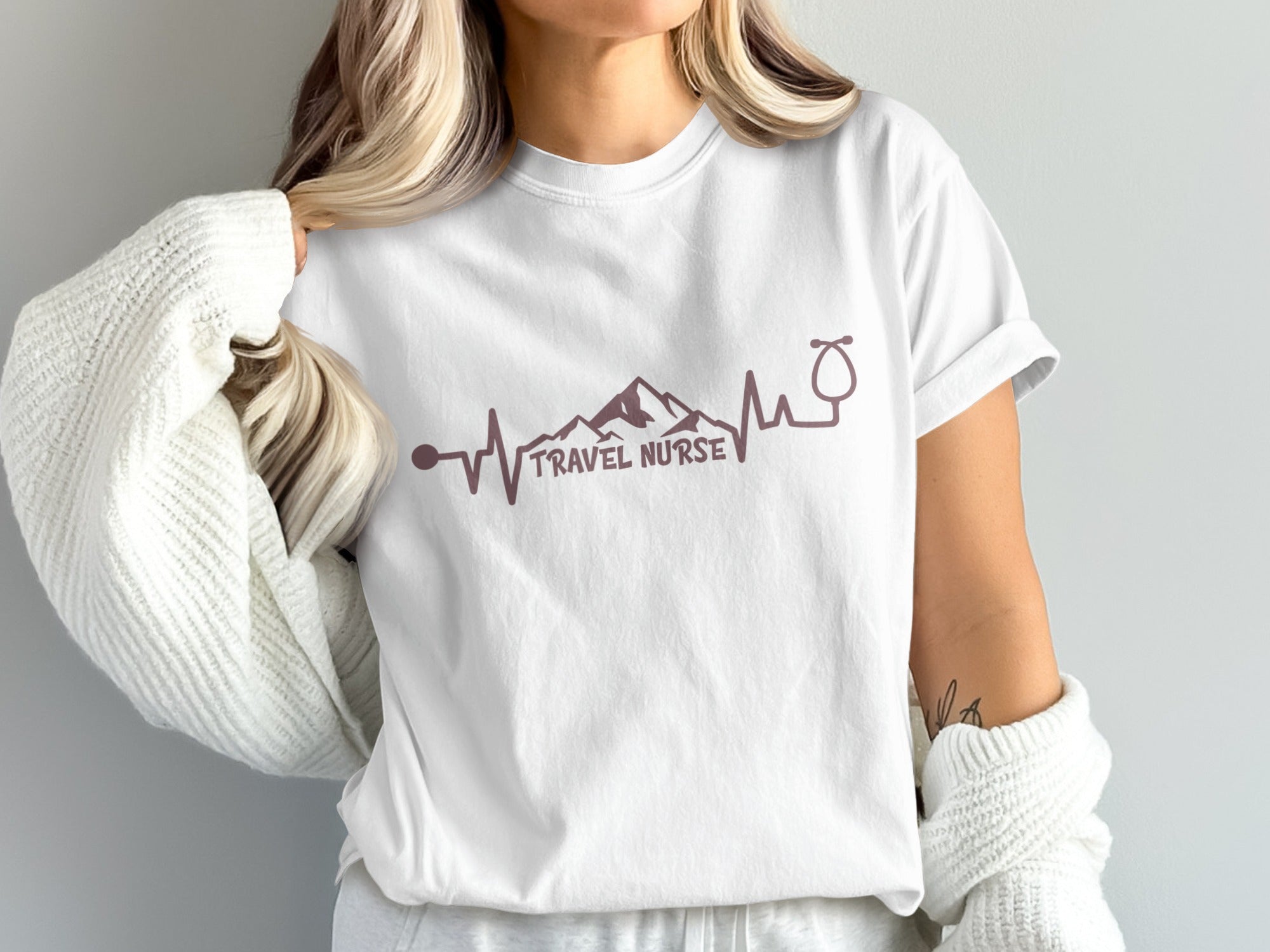 White t-shirt with "TRAVEL NURSE" and a stethoscope ECG design.