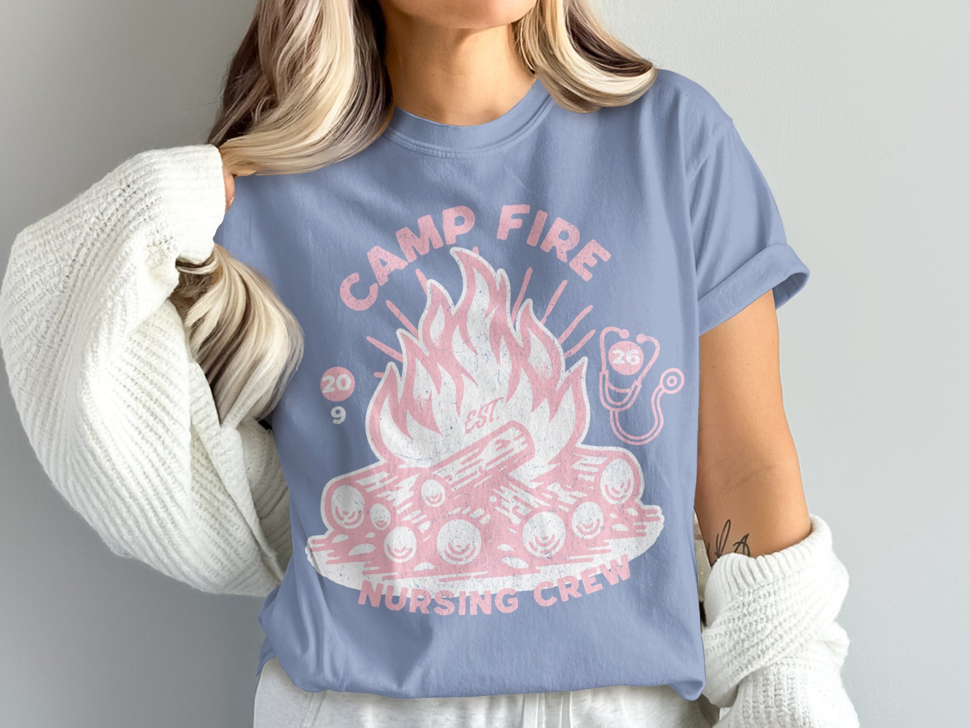 Camp Fire Nursing Crew graphic on a light blue t-shirt.