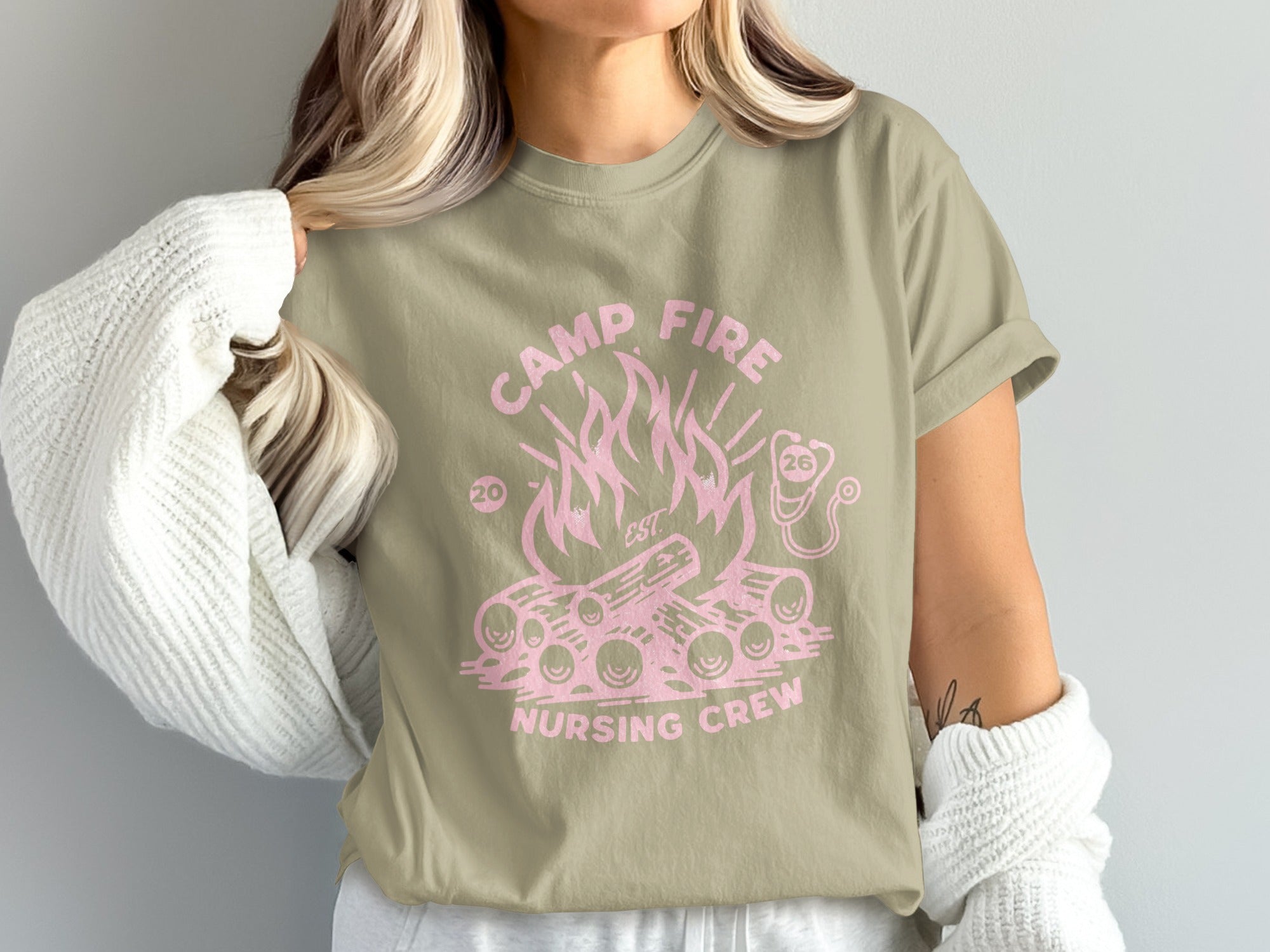 Camp Fire Nursing Crew t-shirt with pink campfire and stethoscope logo.
