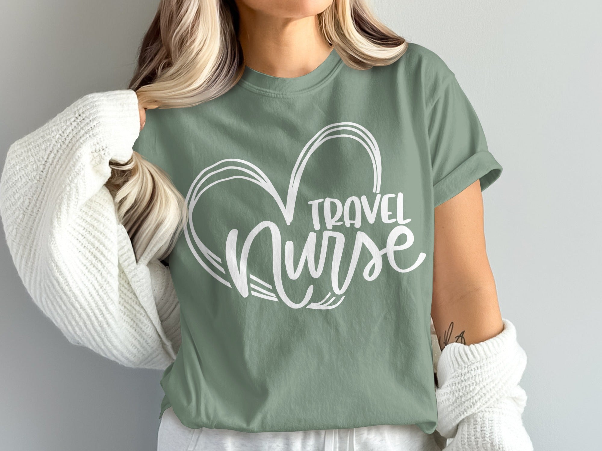 Green t-shirt with "Travel Nurse" text inside a heart outline.