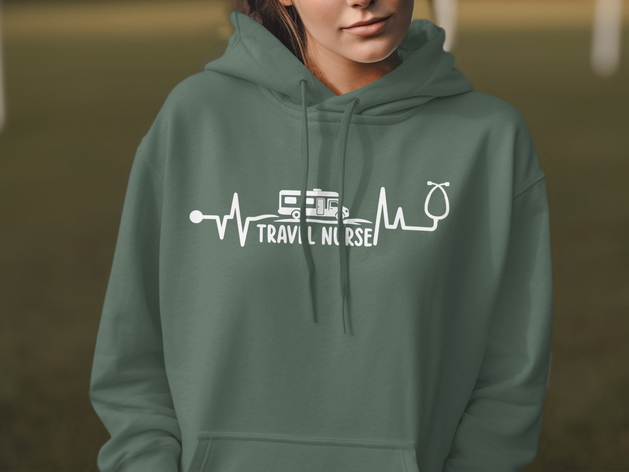 Green hoodie with "Travel Nurse" heartbeat and RV graphic.