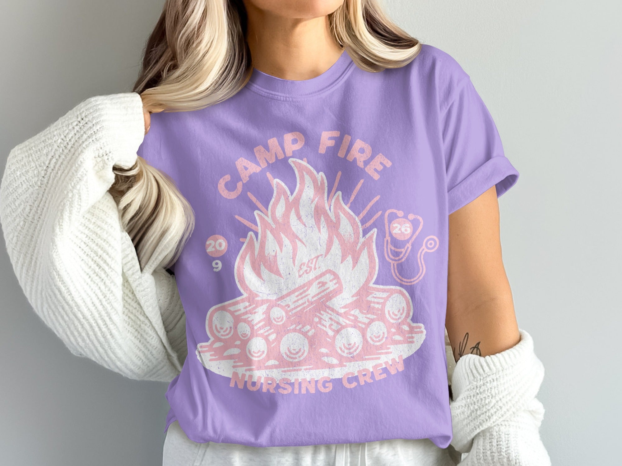 Purple t-shirt with "Camp Fire Nursing Crew" text and campfire graphic.