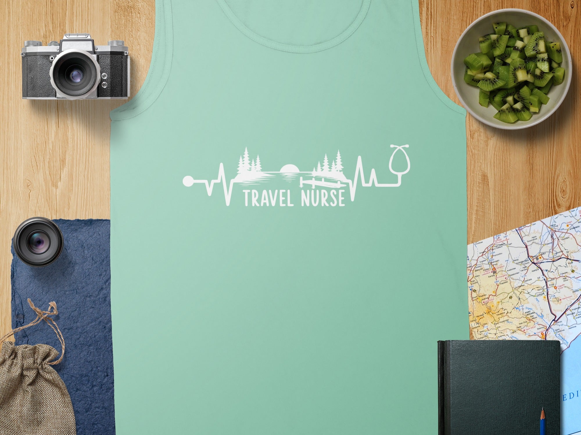Mint green tank top with "Travel Nurse" and heartbeat-stethoscope graphic.