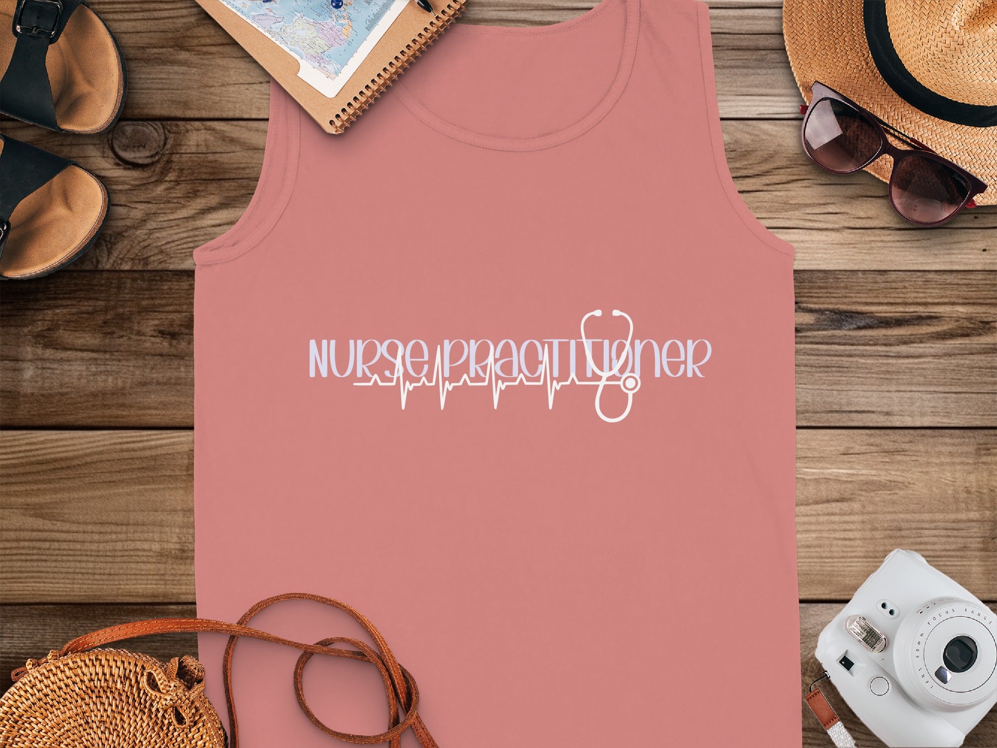 Pink tank top with "Nurse Practitioner" text and a stethoscope heartbeat graphic.