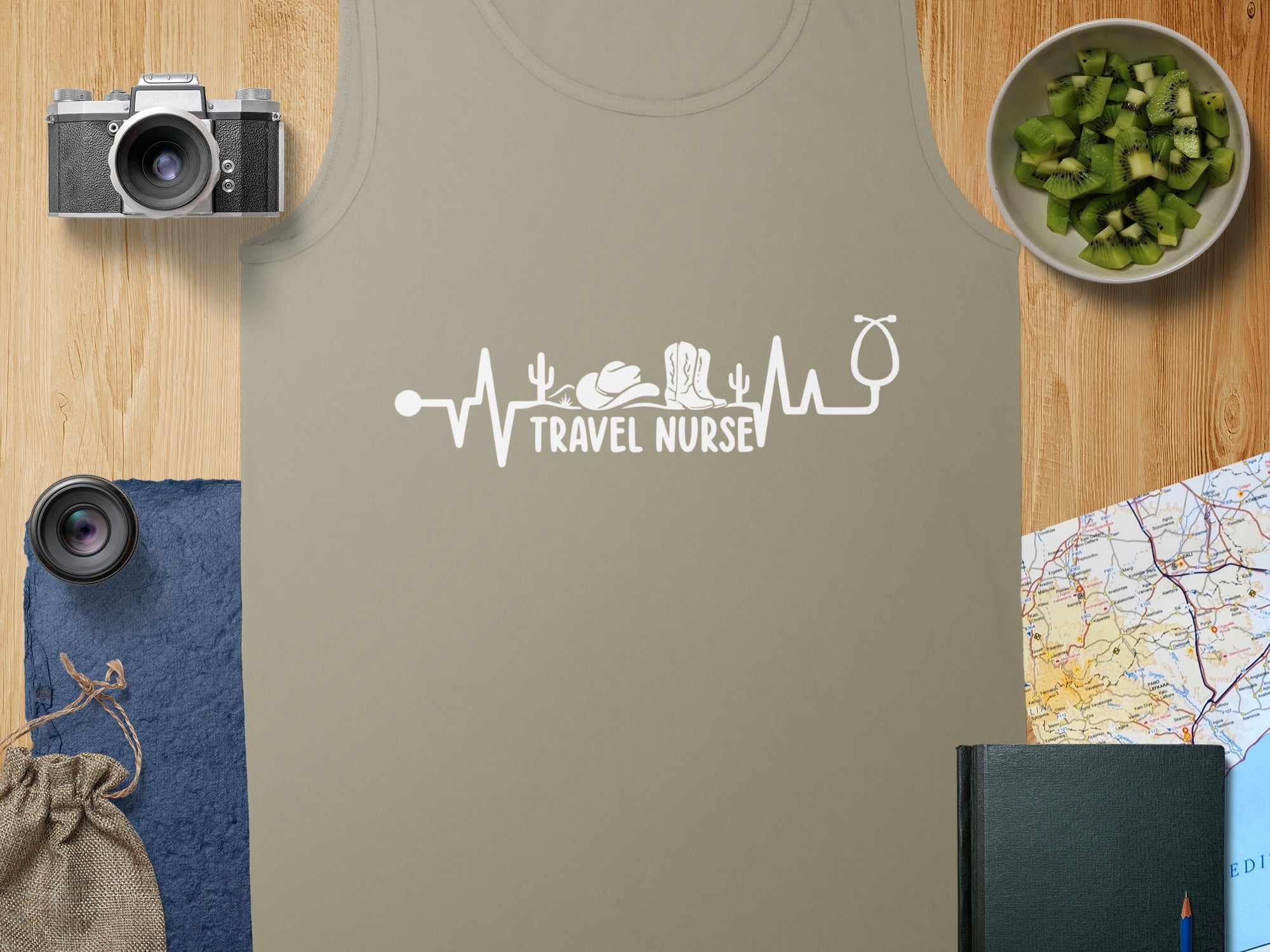 Beige tank top with "Travel Nurse" text and stethoscope, cowboy hat, and boots design.