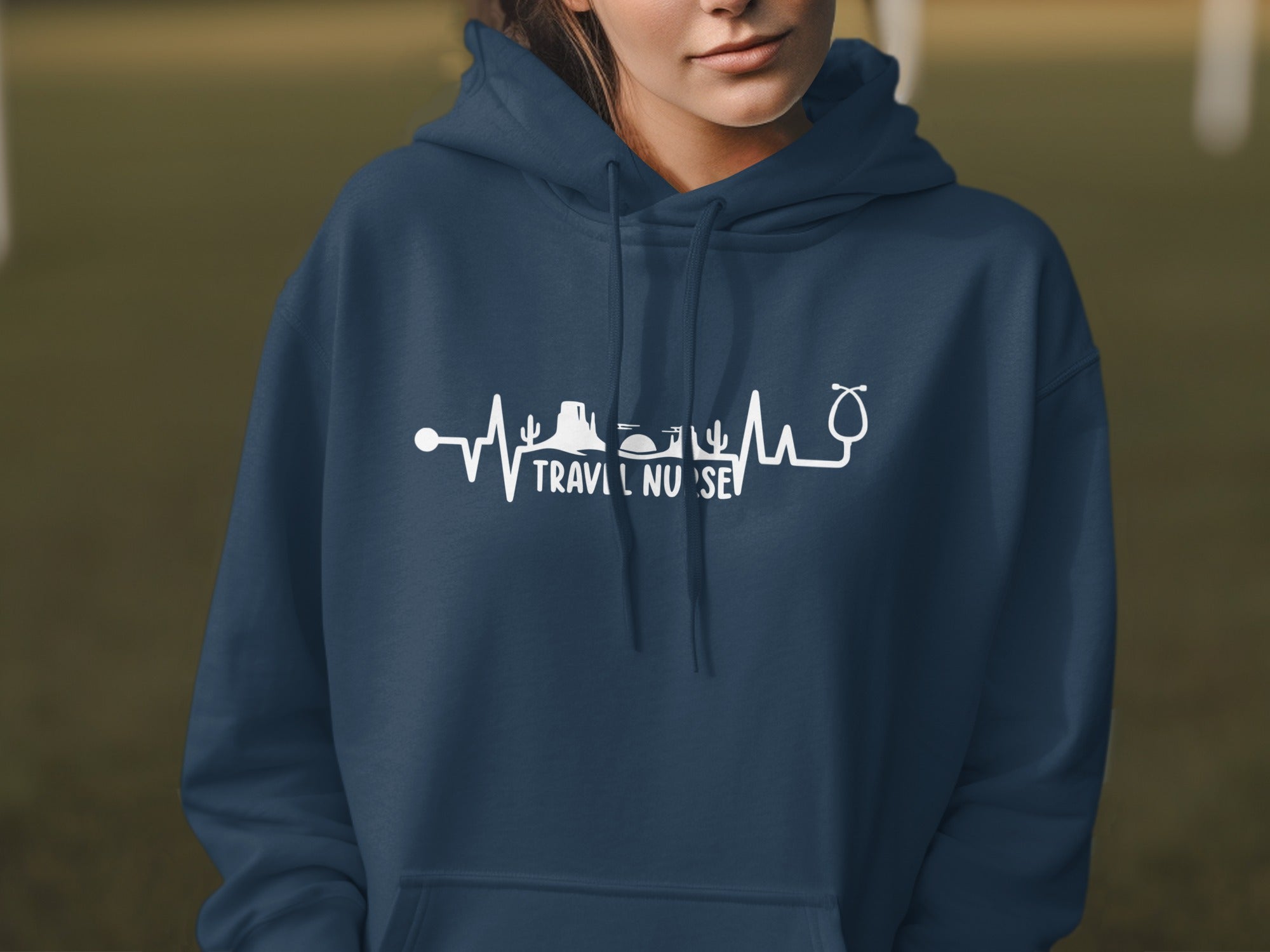 Navy blue hoodie with a white heartbeat graphic featuring mountains, a cactus, and a stethoscope.