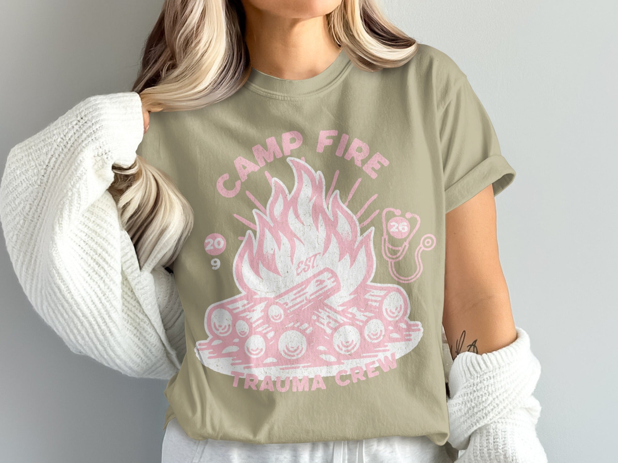 Camp Fire Trauma Crew graphic t-shirt with pink flames and logs.