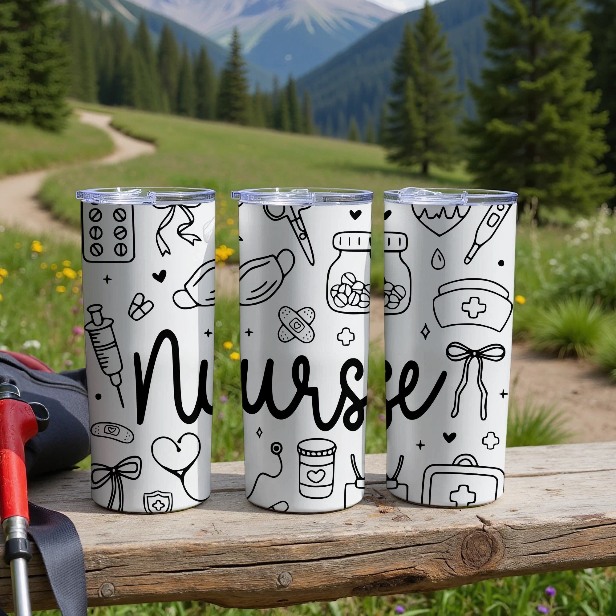Three nurse-themed tumblers with medical icons on a wooden bench.