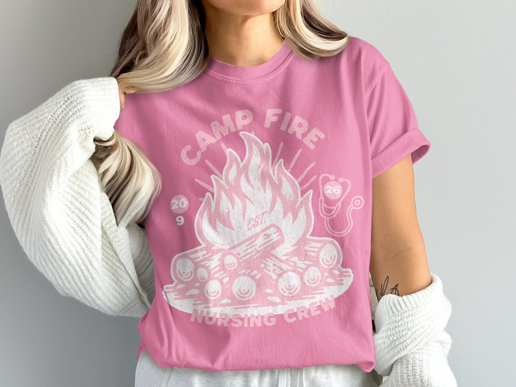 Pink t-shirt with campfire and "Camp Fire Nursing Crew" text.