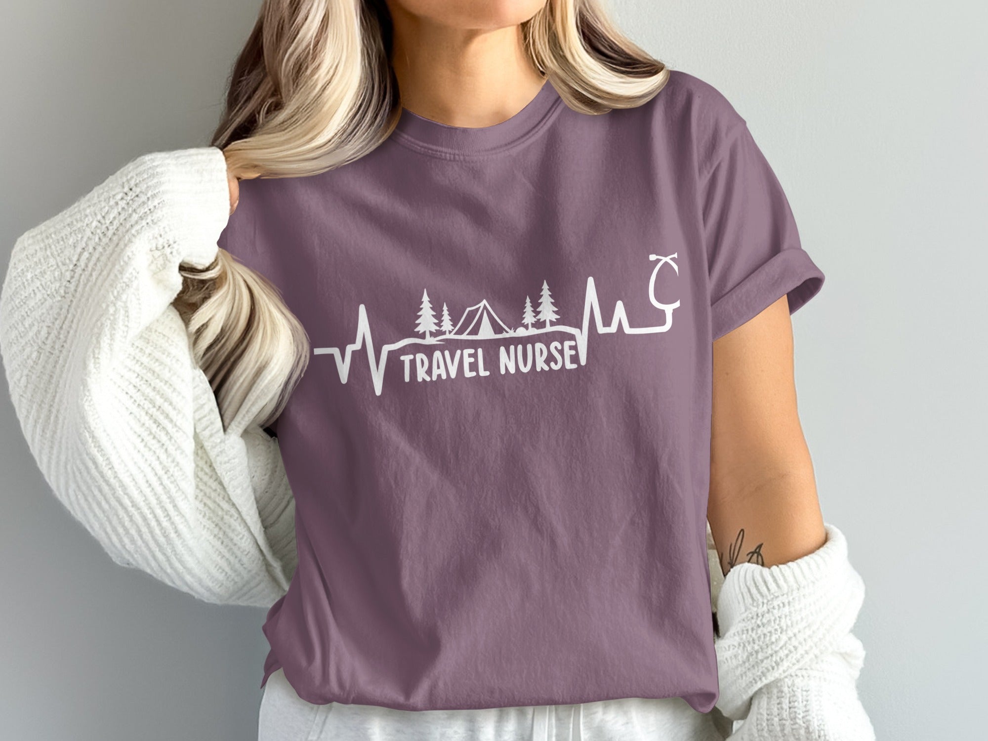 T-shirt with "Travel Nurse" text, stethoscope, and camping graphic.