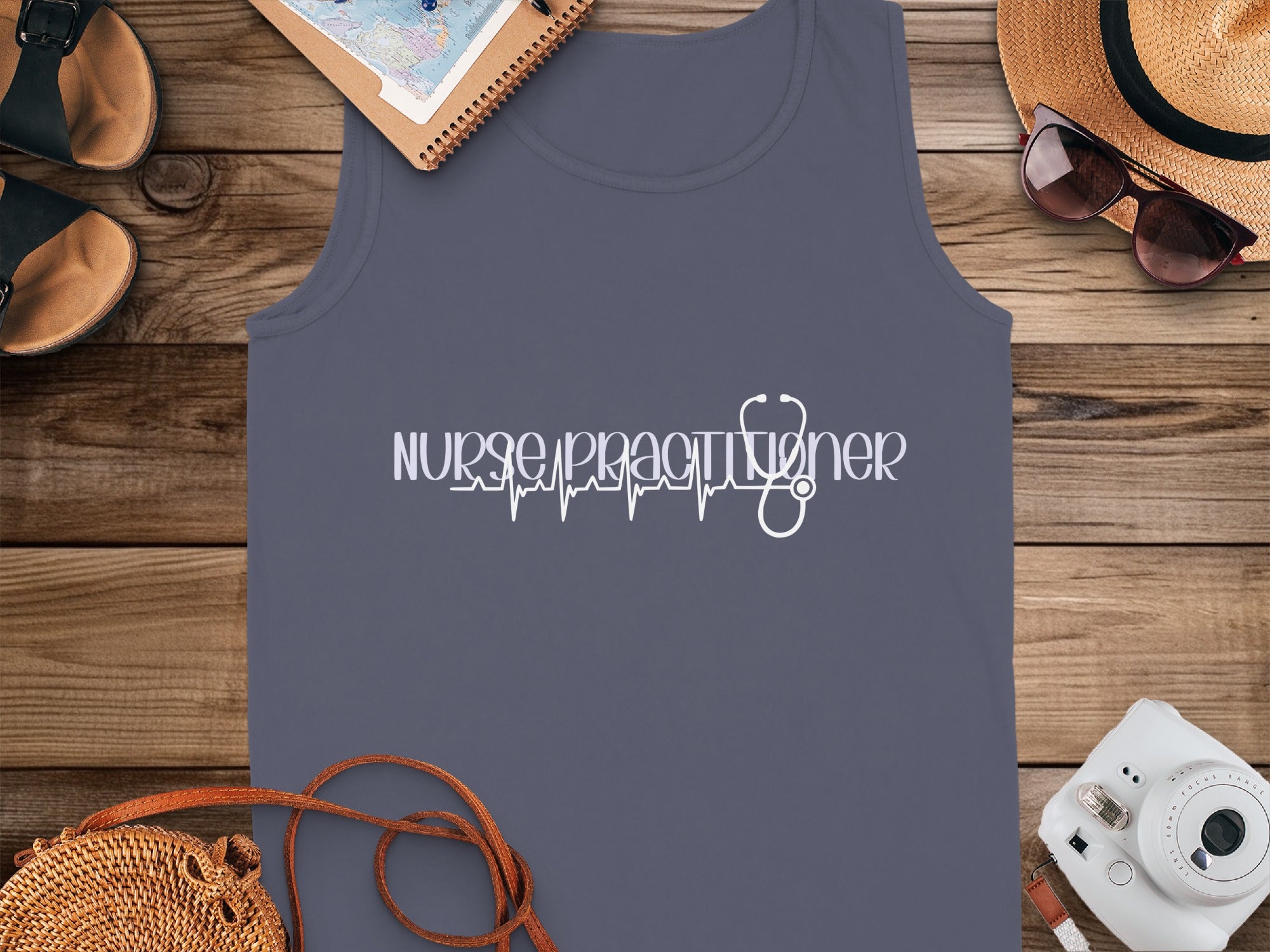 Dark grey tank top with white "Nurse Practitioner" text and a stethoscope ECG.