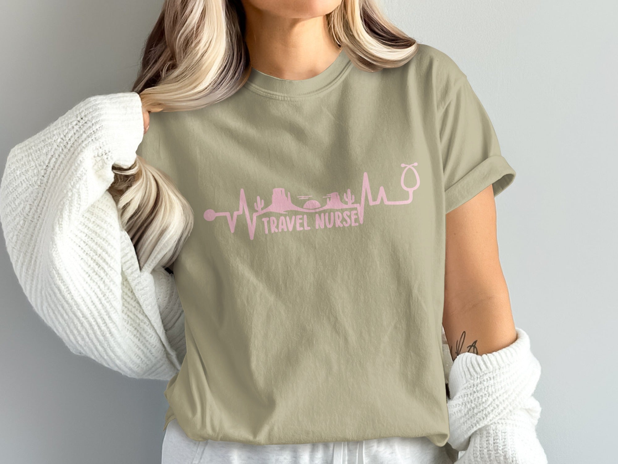 T-shirt with pink heartbeat graphic featuring desert landscape and "TRAVEL NURSE" text.