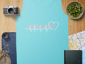 Teal tank top with "Travel Nurse" in pink heartbeat and heart graphic.