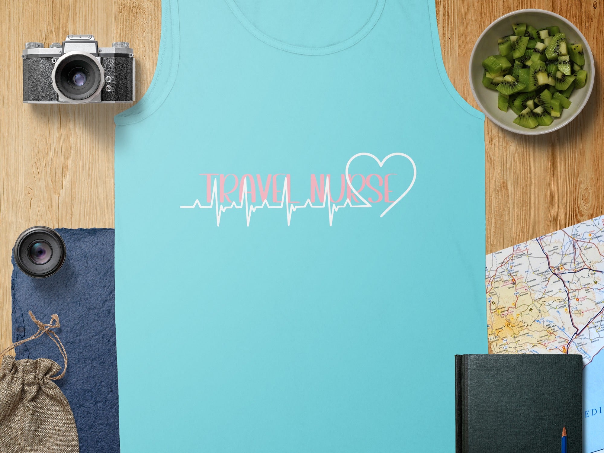 Teal tank top with "Travel Nurse" in pink heartbeat and heart graphic.