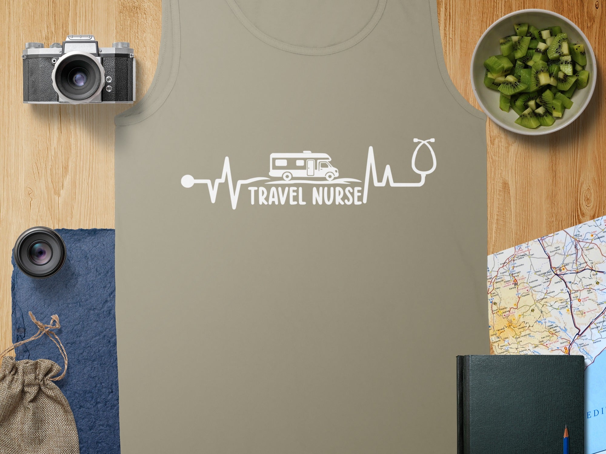 White "TRAVEL NURSE" text on a beige tank top with a heartbeat and RV graphic.