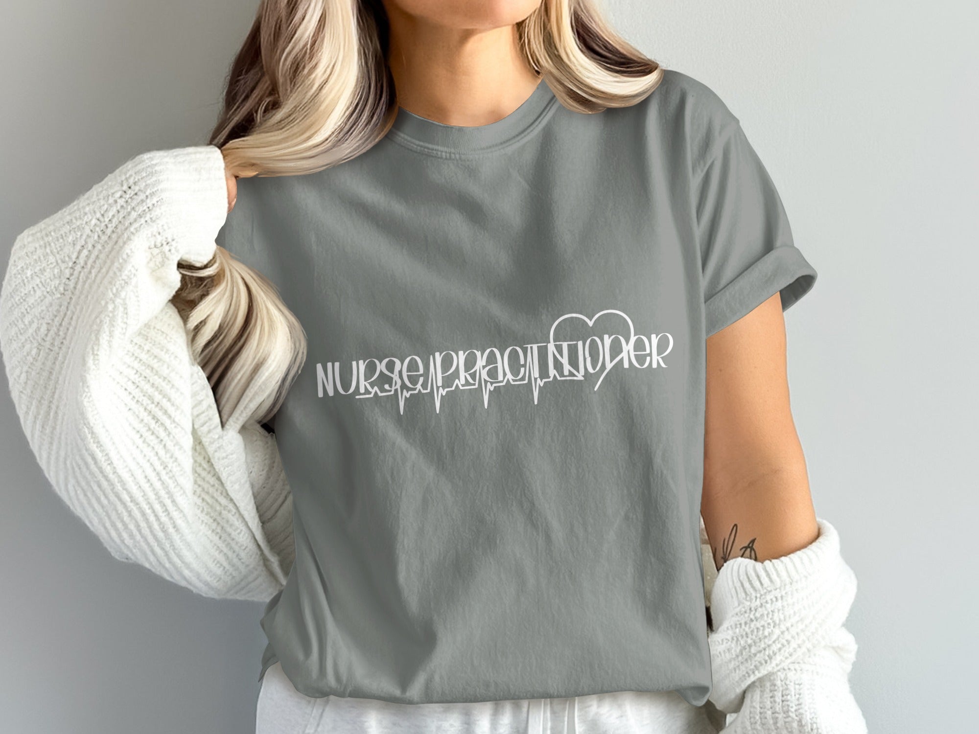 Grey t-shirt with "Nurse Practitioner" and heartbeat graphic.