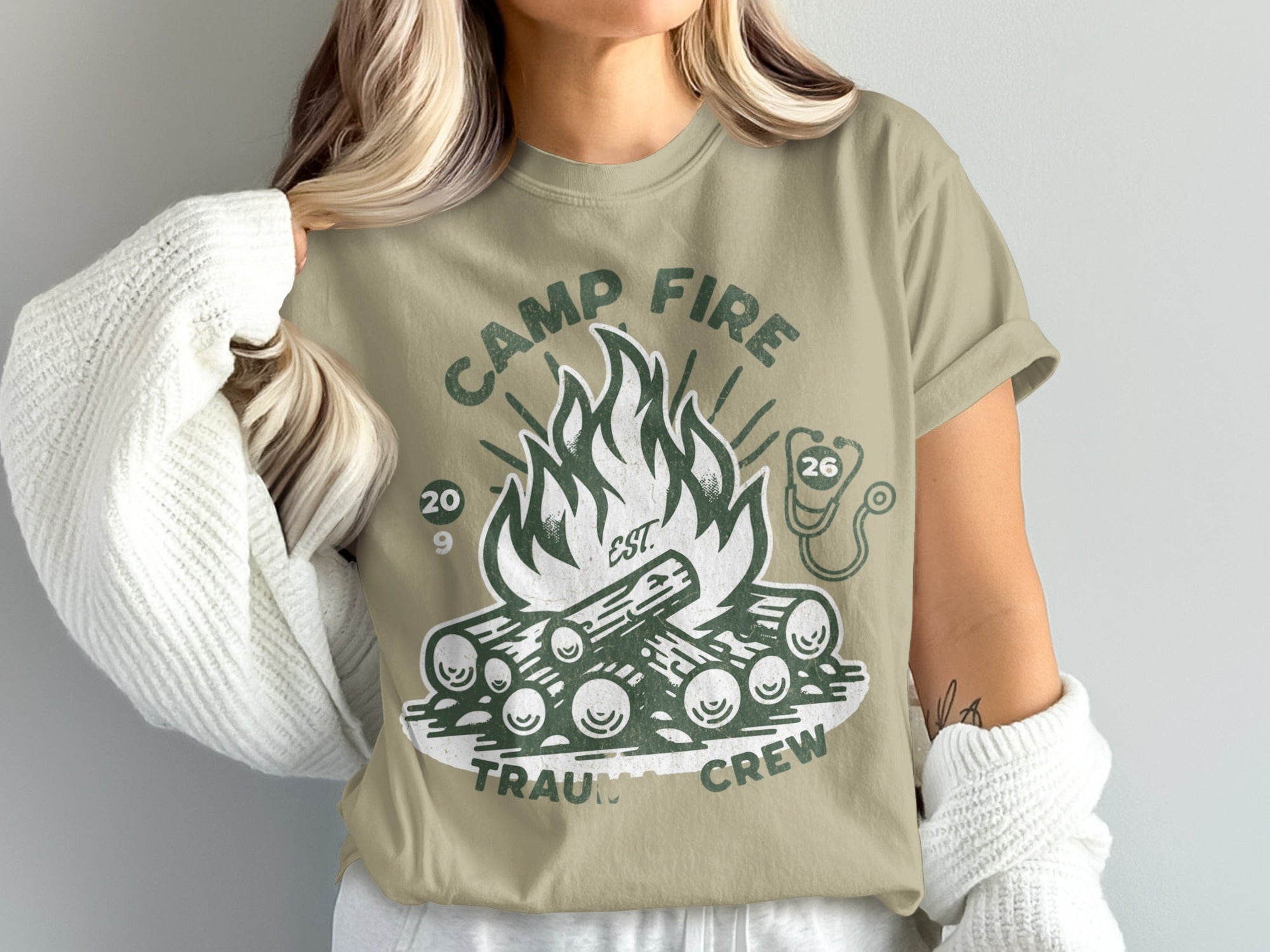 Camp Fire Trauma Crew logo with bonfire, stethoscope, and years 20 & 26.