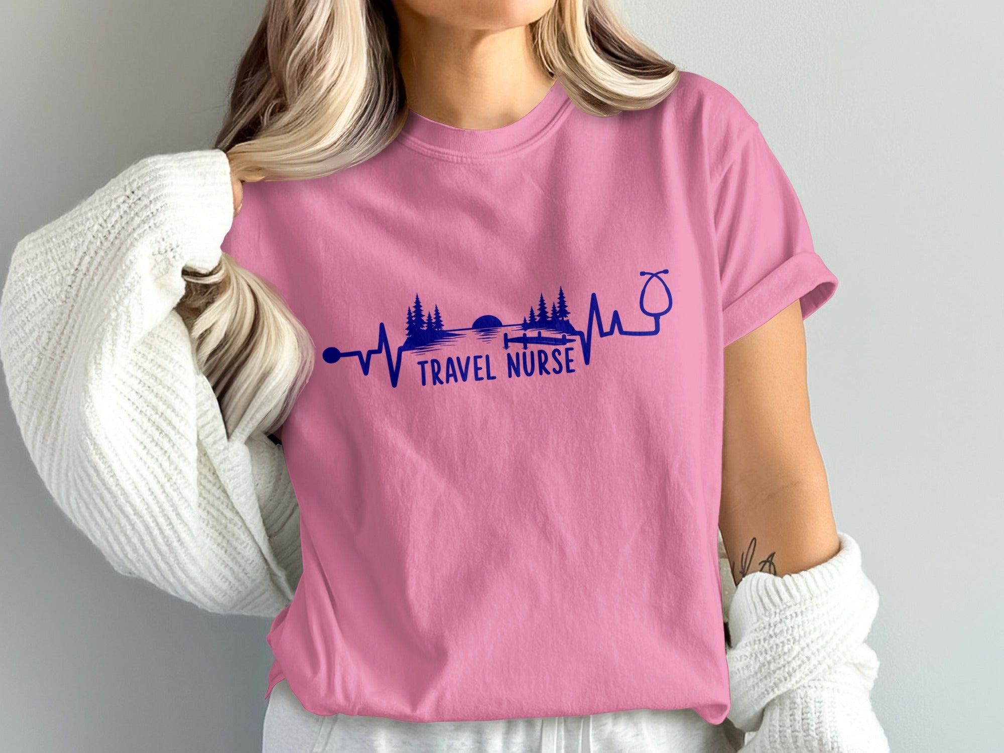 Pink t-shirt with "TRAVEL NURSE" text and stethoscope design.
