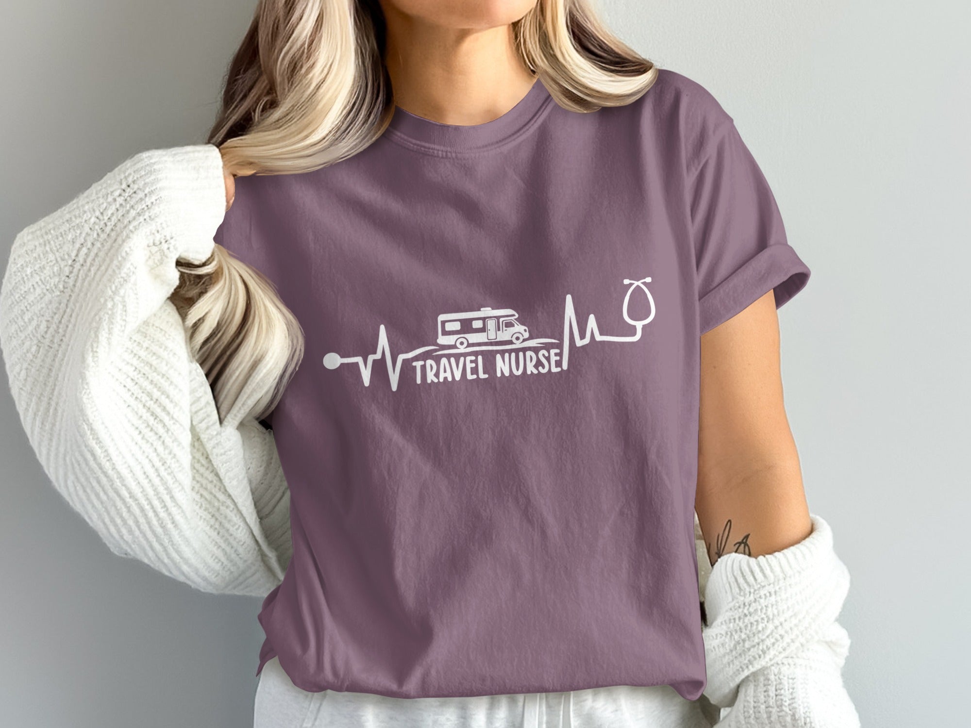 Purple t-shirt with "Travel Nurse" text and a heartbeat graphic.