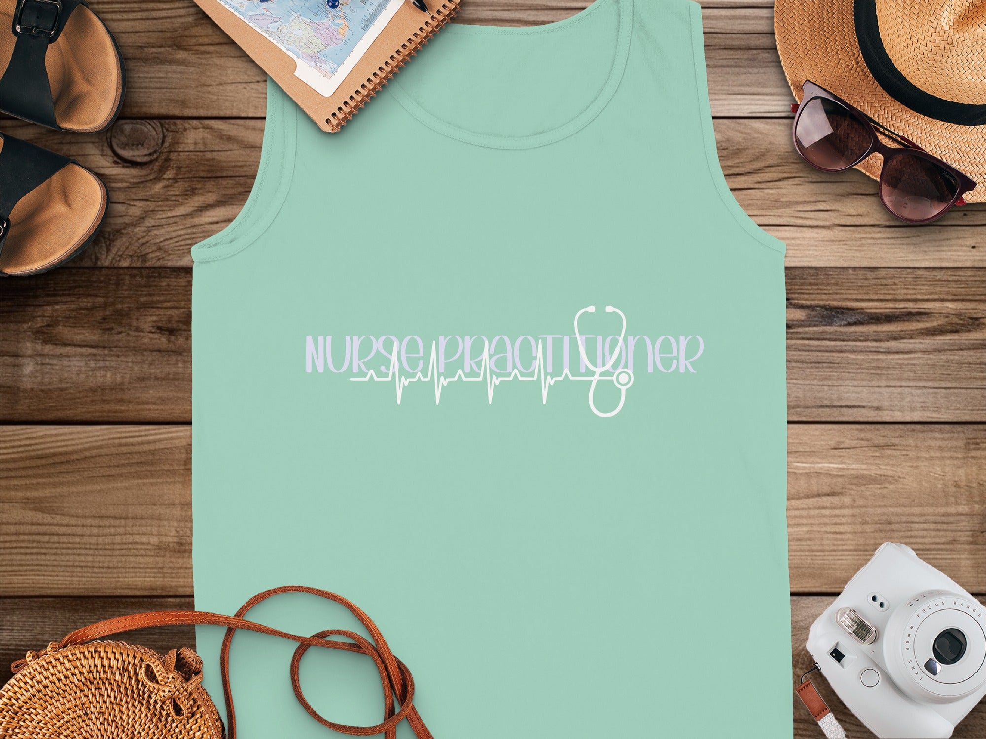 Light mint green tank top with stethoscope heartbeat design and "Nurse Practitioner" text.