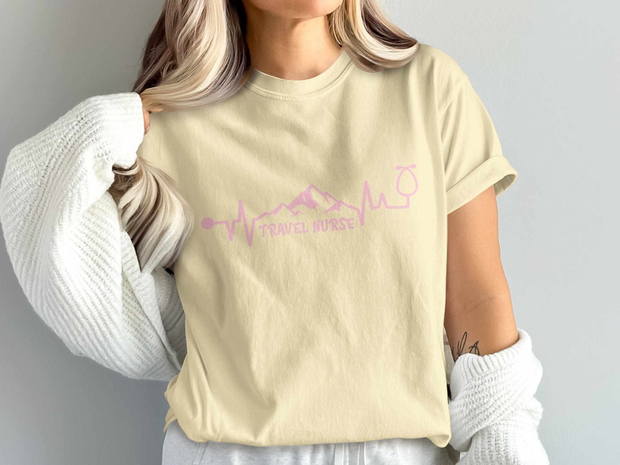 Light yellow t-shirt with "TRAVEL NURSE" text and a medical symbol.