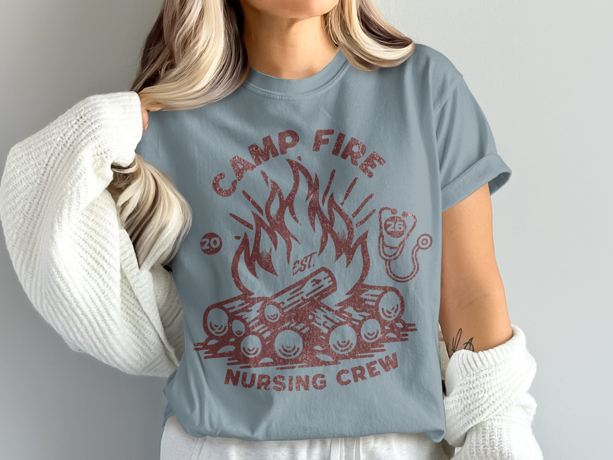 Camp Fire Nursing Crew graphic tee with campfire and stethoscope illustration.