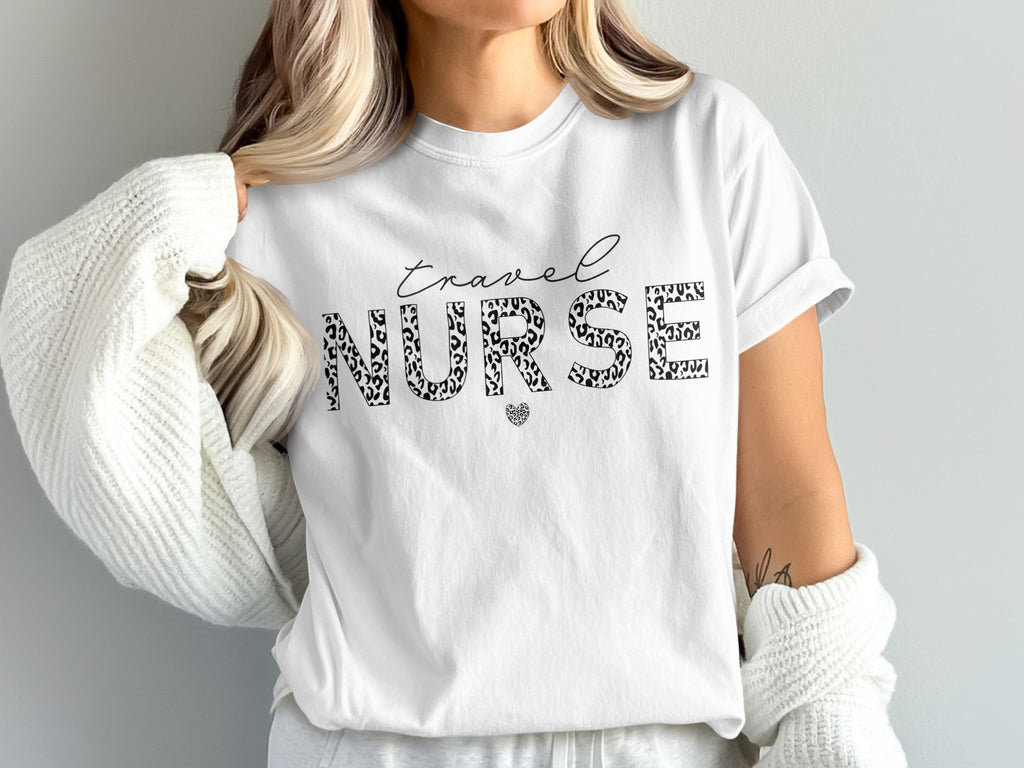 White t-shirt with "Travel Nurse" in leopard print and a small heart.