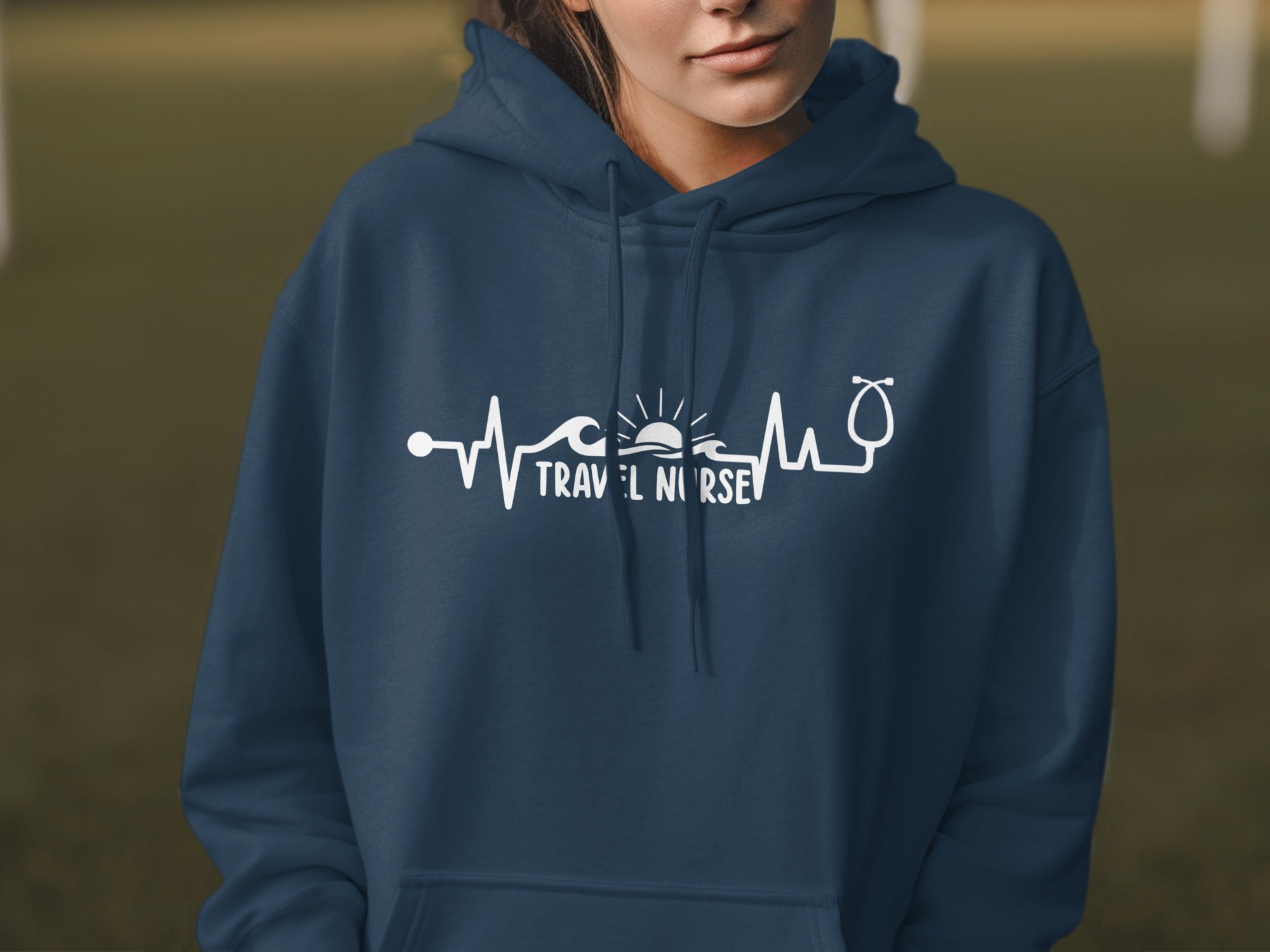 Navy hoodie with travel nurse electrocardiogram graphic.