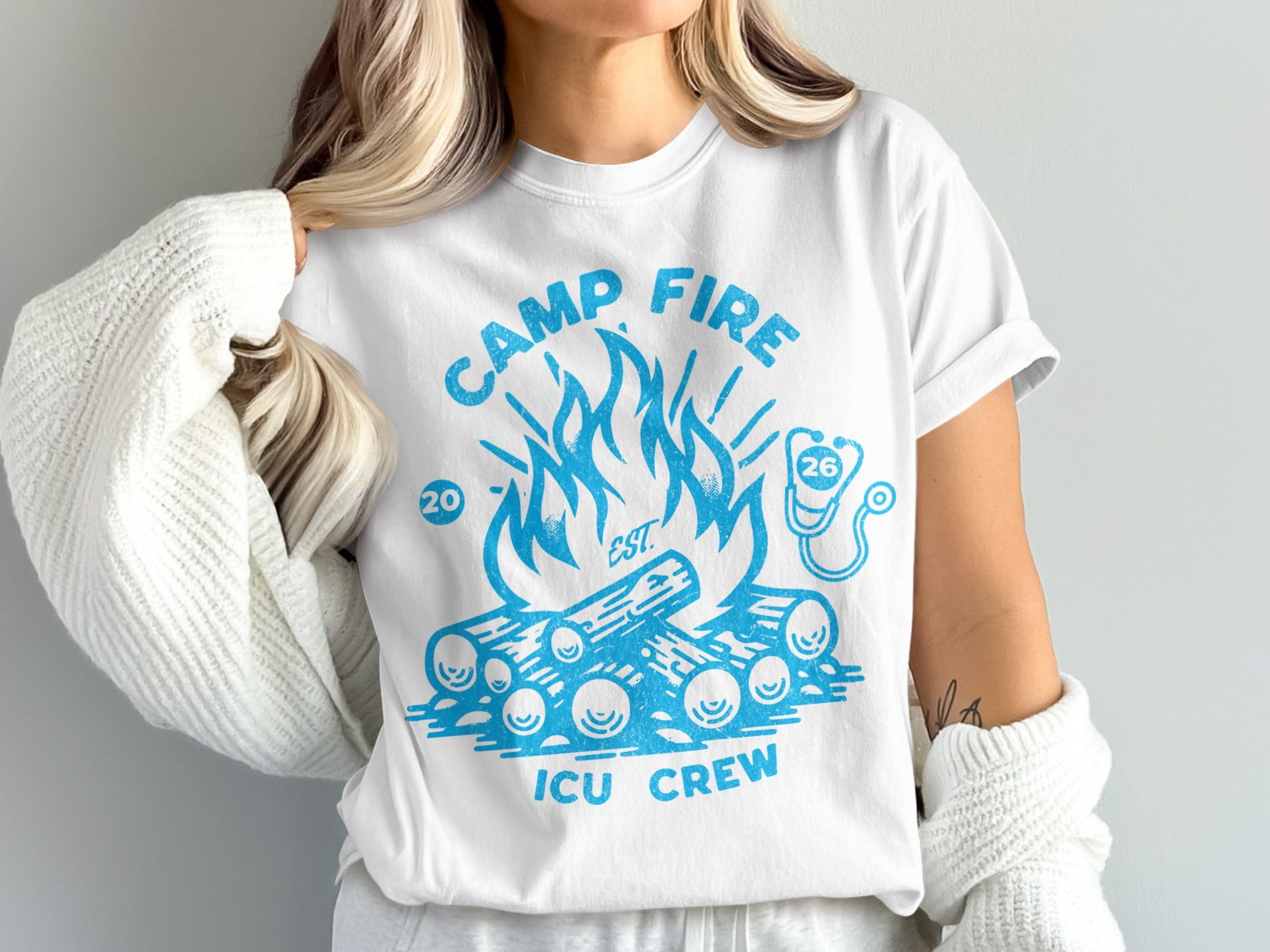 White t-shirt with blue campfire and "ICU Crew" text.