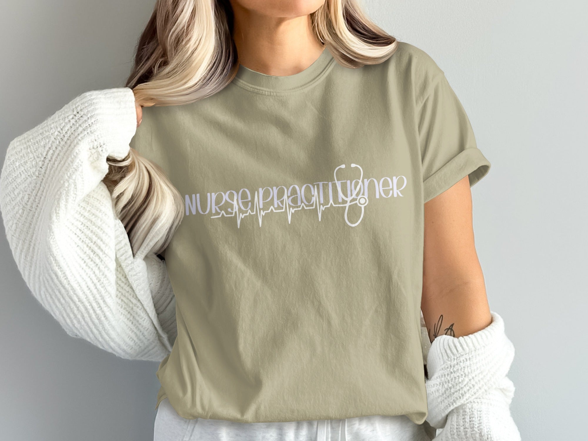 T-shirt with "Nurse Practitioner" text and stethoscope graphic.