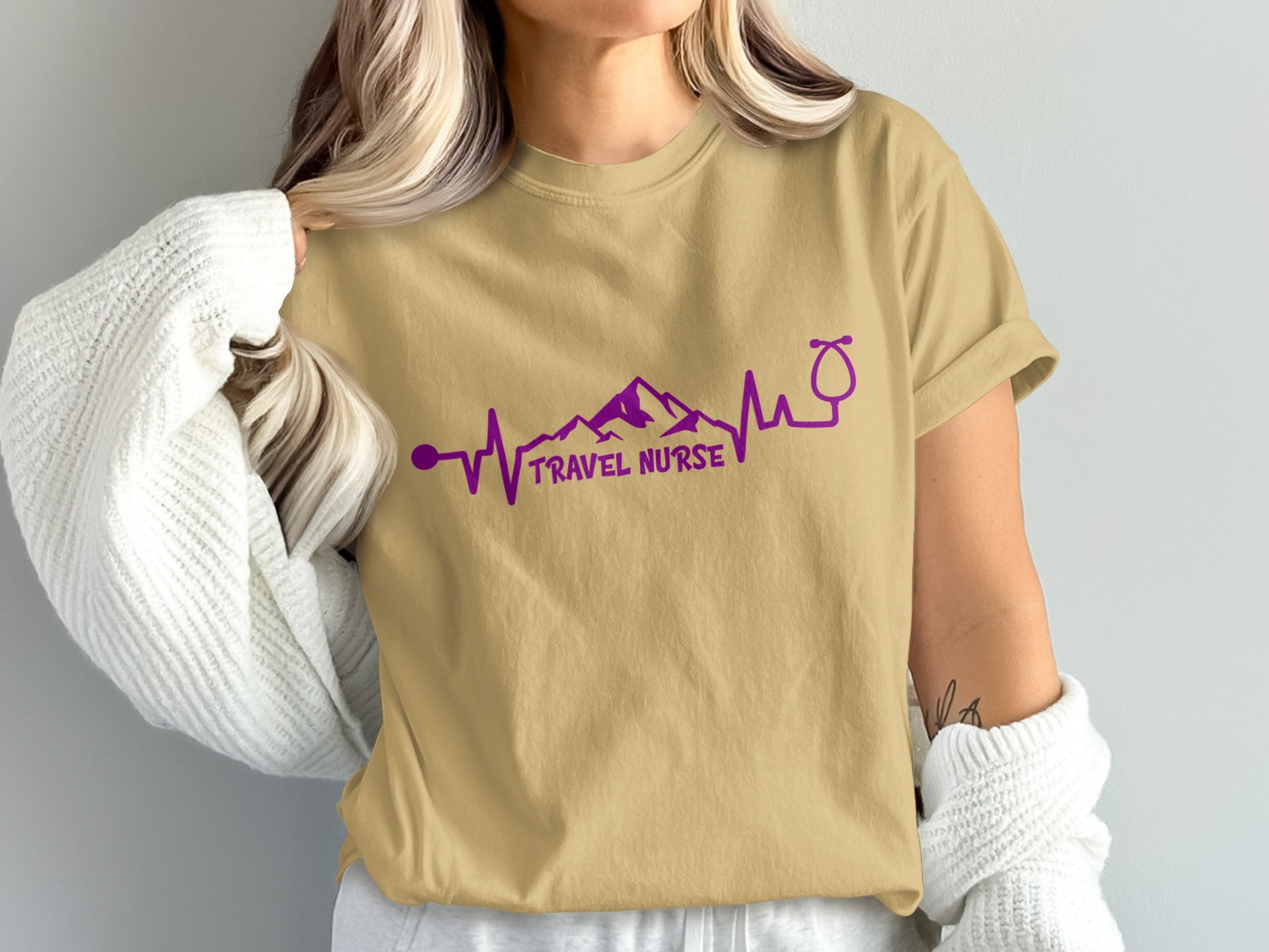 T-shirt with mountain range heartbeat and stethoscope graphic, "TRAVEL NURSE" text.