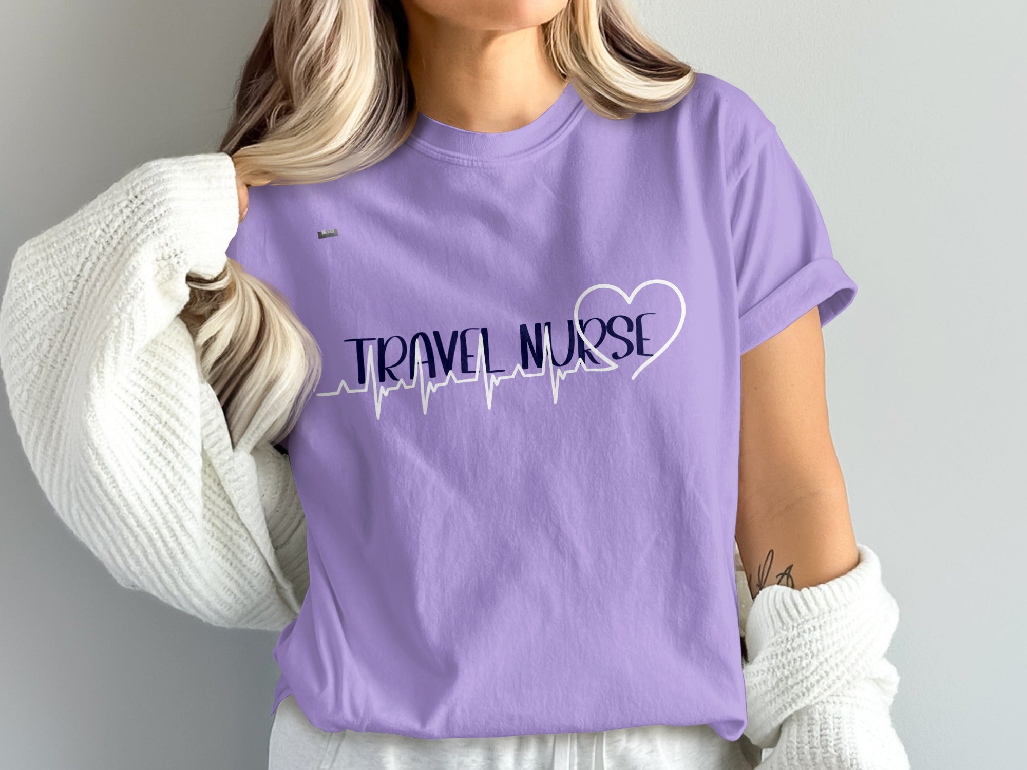 Purple t-shirt with "TRAVEL NURSE" and a heartbeat line with heart.