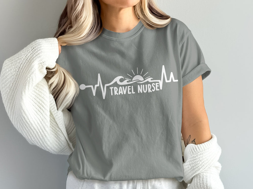 Gray t-shirt with white "Travel Nurse" text and a heartbeat graphic.