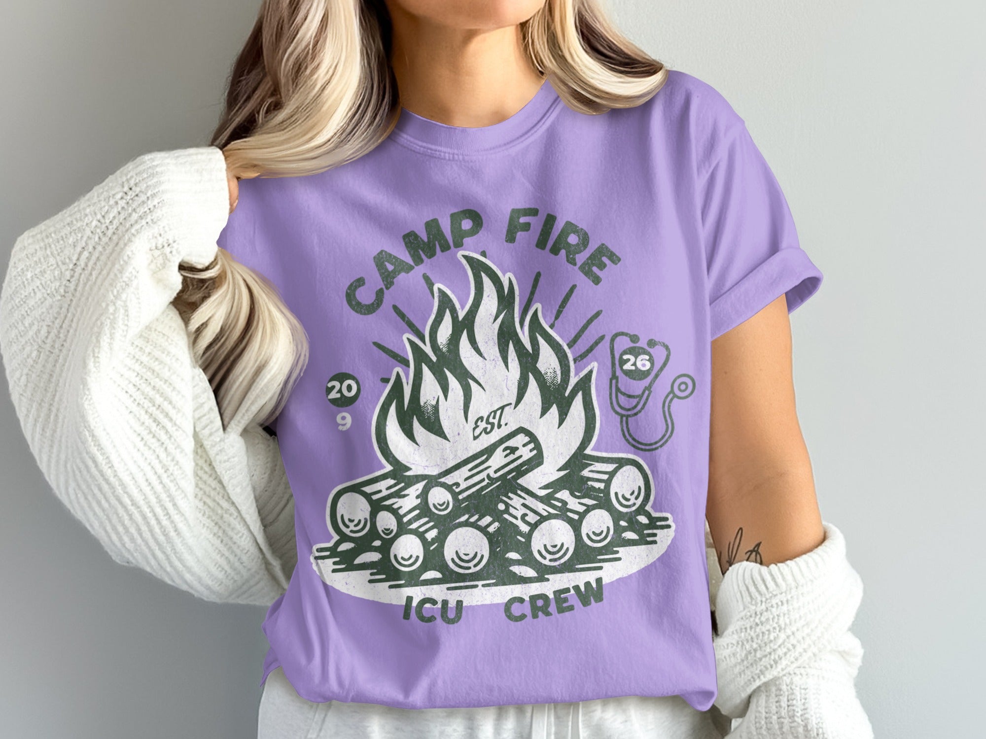 Purple t-shirt with "CAMP FIRE ICU CREW" and bonfire graphic.