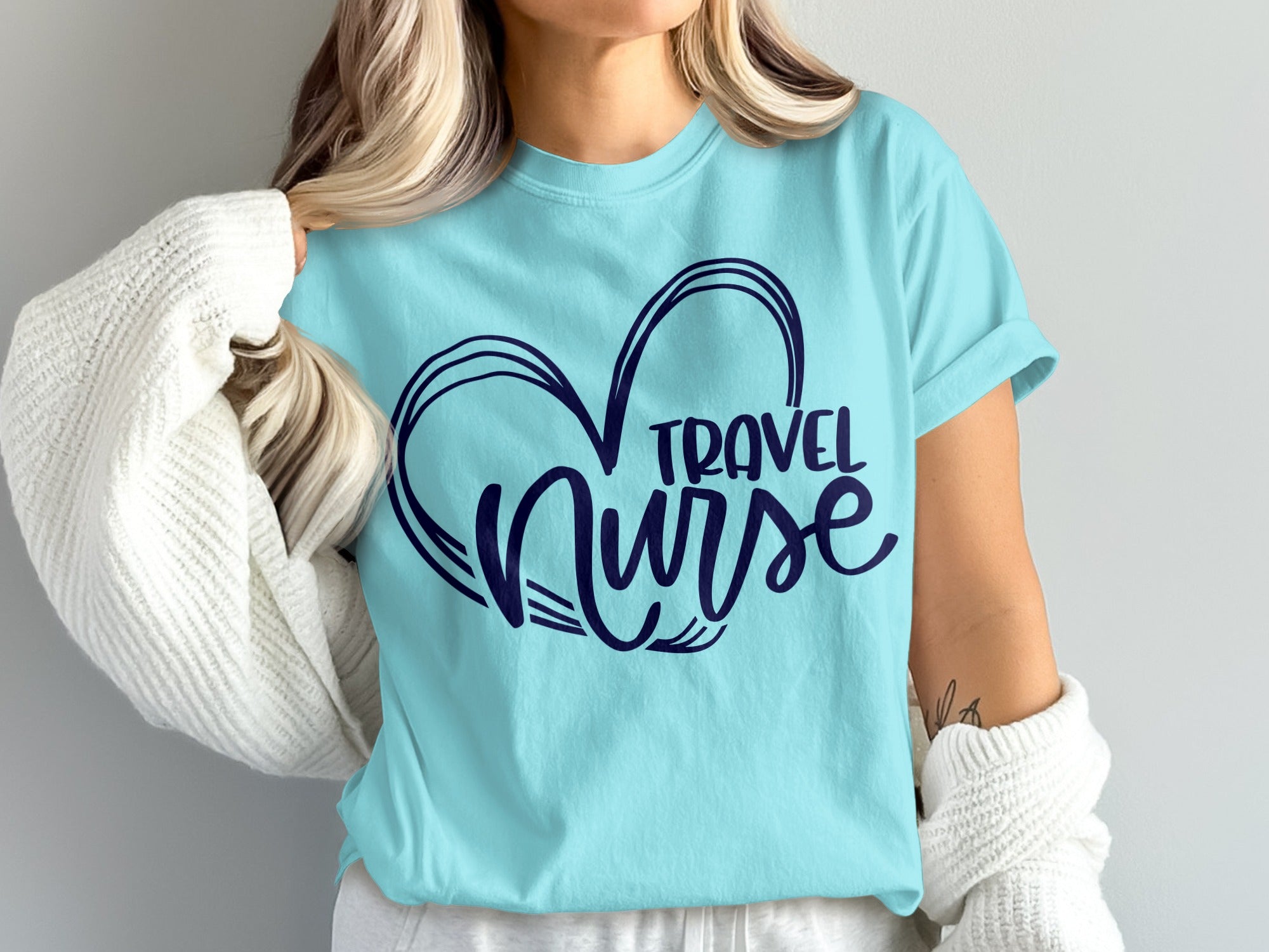 Light blue t-shirt with "TRAVEL NURSE" inside a heart design.